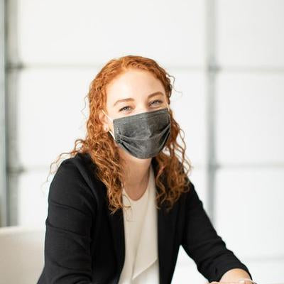 Woman wearing Charcoal Gray Aries Barrier Face Covering